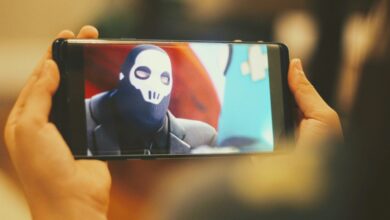 person holding black android smartphone