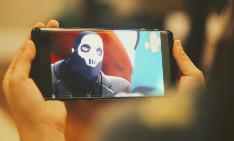 person holding black android smartphone