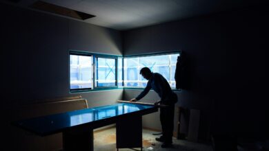 silhouette photography of man inside dim-lighted room